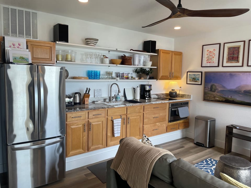 Kitchen with full size refrigerator, coffee maker and convection oven/microwave.