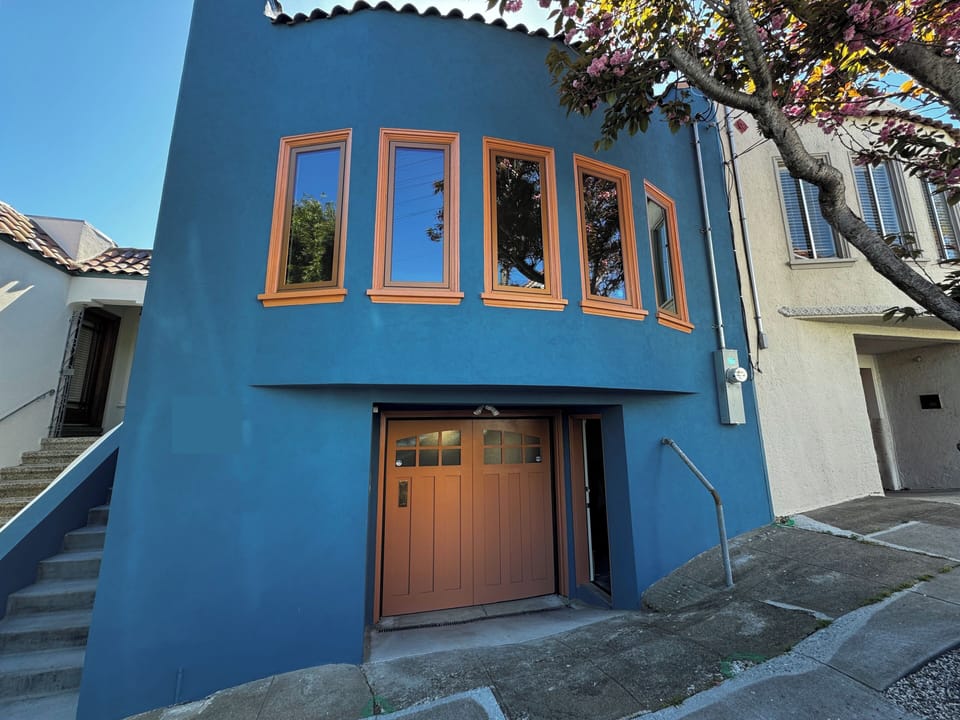 Front of house - private entrance downstairs next to garage