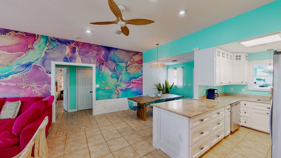 The heart of your beach house stay — an open kitchen and dining area perfect for shared meals and seaside memories.