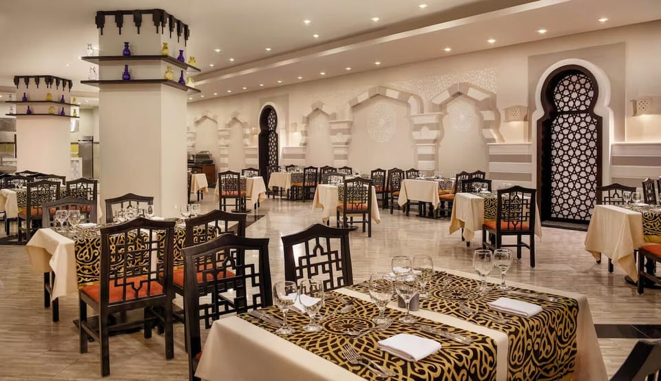 Dine in ornate elegance with warm lighting and comfort.