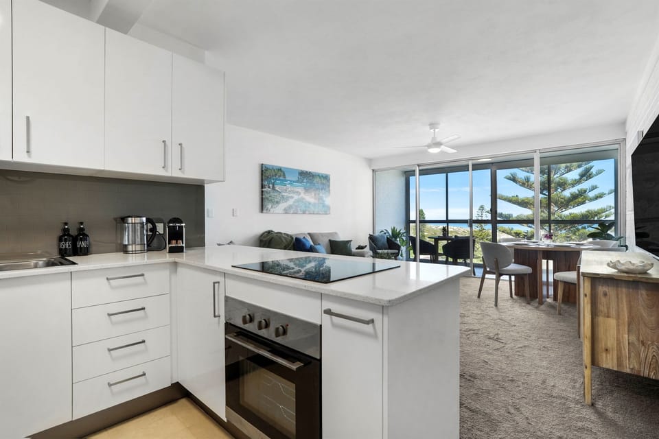 Open-plan kitchen and living space with ocean views—perfect for entertaining or unwinding after a day at the beach.
