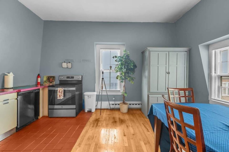 Fully-stocked kitchen with modern appliances and a cozy dining nook.