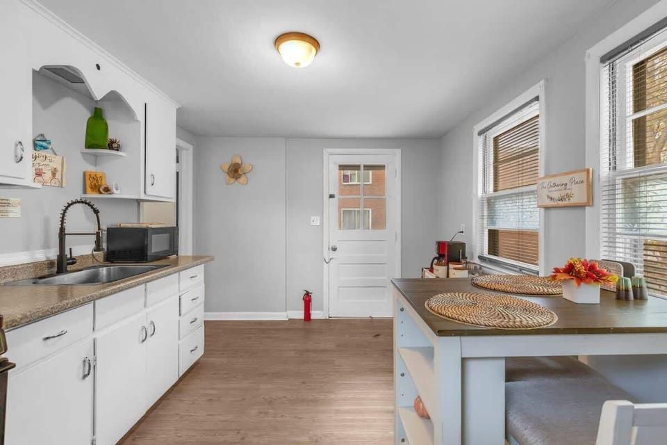 Fully equipped kitchen with modern appliances and ample counter space.