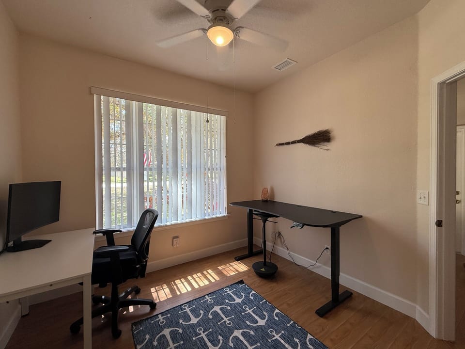 The office is at the front of the house, right by the formal dining room.