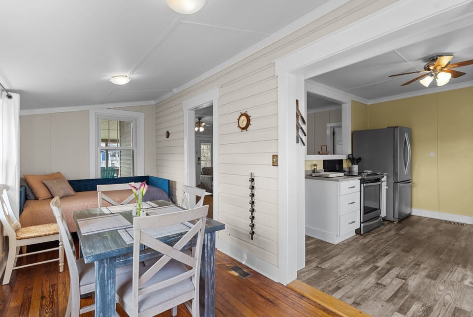 Indoor dining space with seating for four offers a cozy place for meals, game nights, and gathering with family and friends.