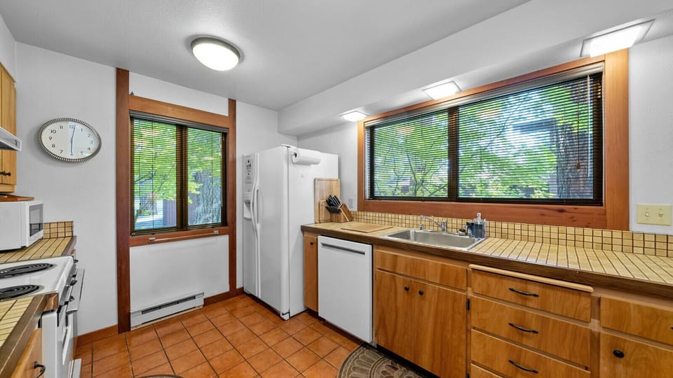 The sparkling vintage kitchen blends nostalgic charm with everyday comfort.