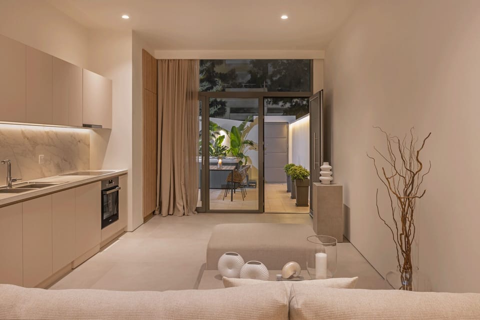 Living area, fully equipped kitchen featuring