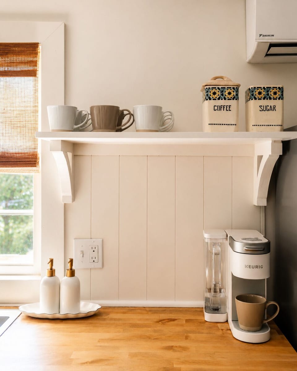 Brew a cup on the Keurig and grab coffee or sugar from the jars on the shelf. This little counter nook makes your morning routine simple before heading out for the day.