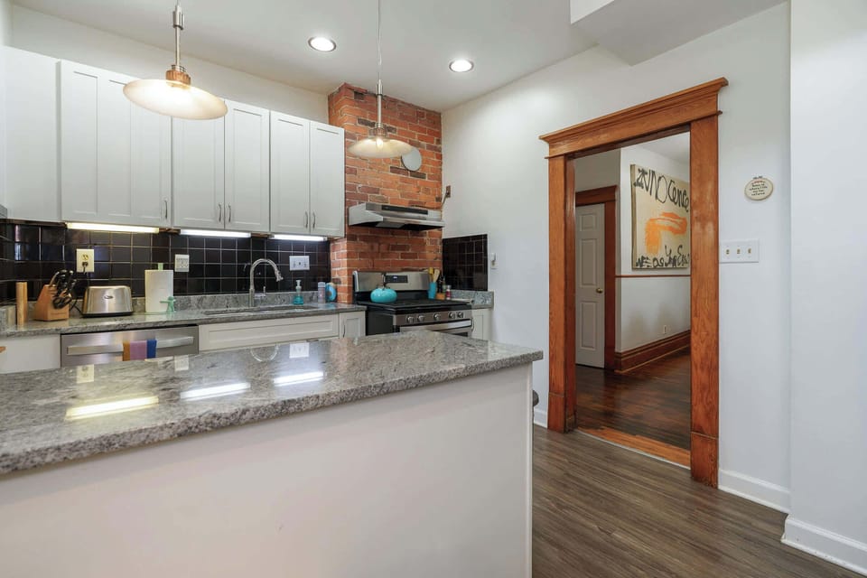 Kitchen: Our bright, remodeled kitchen with every possible thing you could ever need to cook or bake.