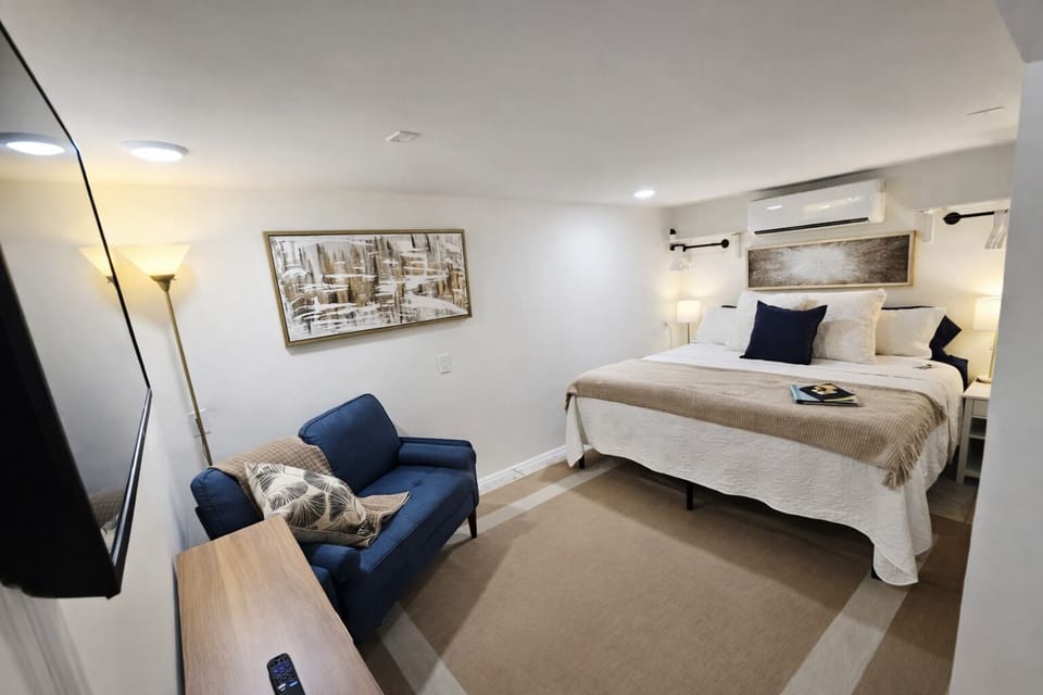 King bed with smart TV and mini couch