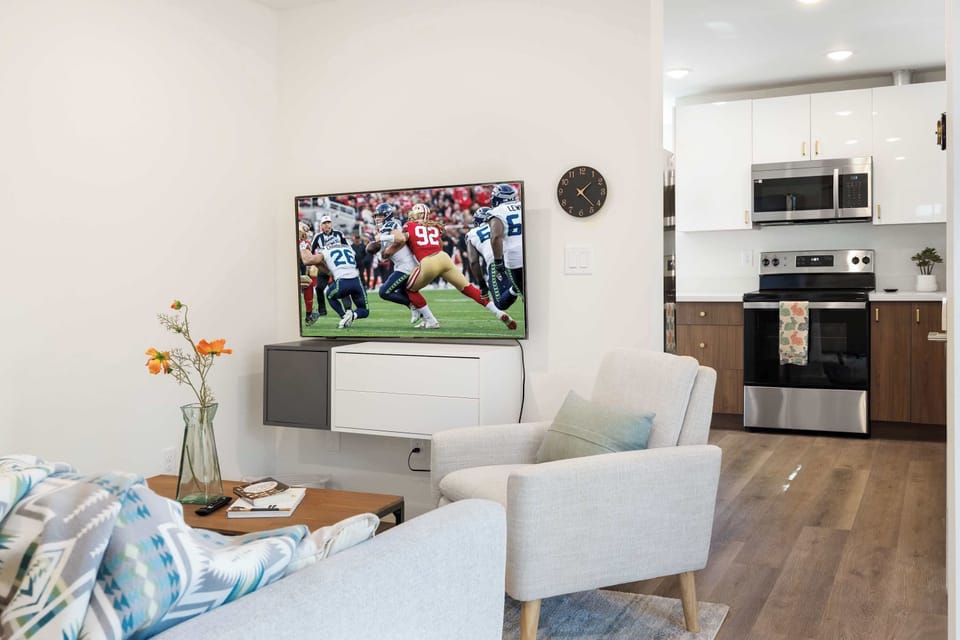 Movie night vibes meet modern comfort—a living room built for relaxation and shared moments.