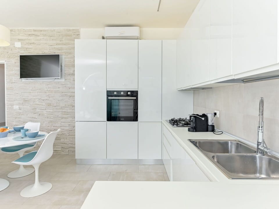 Countertop, Kitchen, Flooring, Interior Design, Wall, Cabinetry, Kitchen Appliance, Floor, Wood, Furniture