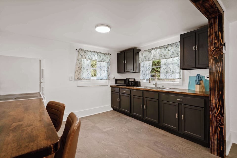 Kitchen area w/ spacious counters & cabinetry, ideal for prepping meals with ease