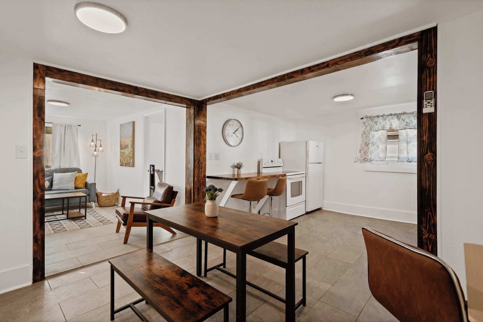 Dining space w/ wooden table & chairs, perfect for shared meals & conversation