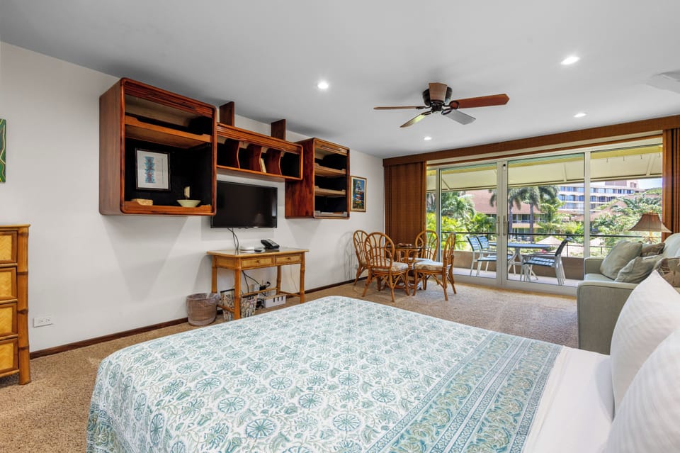 Settle into your spacious room where rich wood accents and breezy island décor set the tone for relaxation. Step onto your private balcony to enjoy tropical views and fresh air.
