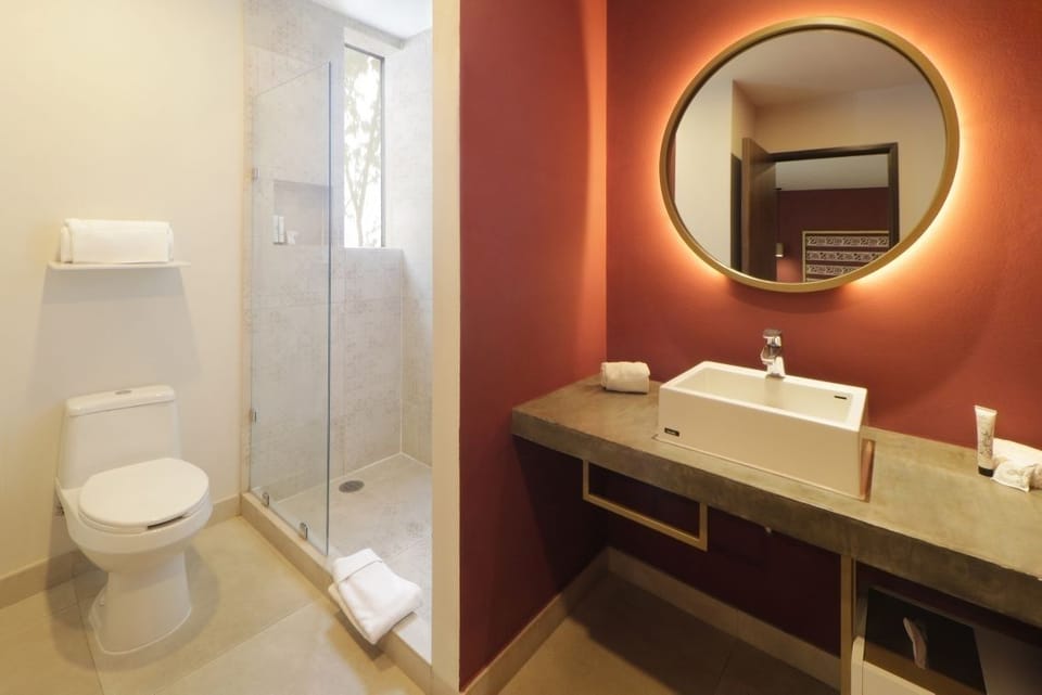 Refresh easily in a bright bath with glass walk-in shower.