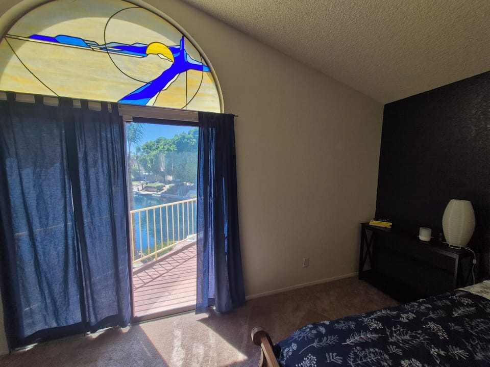 Master bedroom with deck and view of the lake