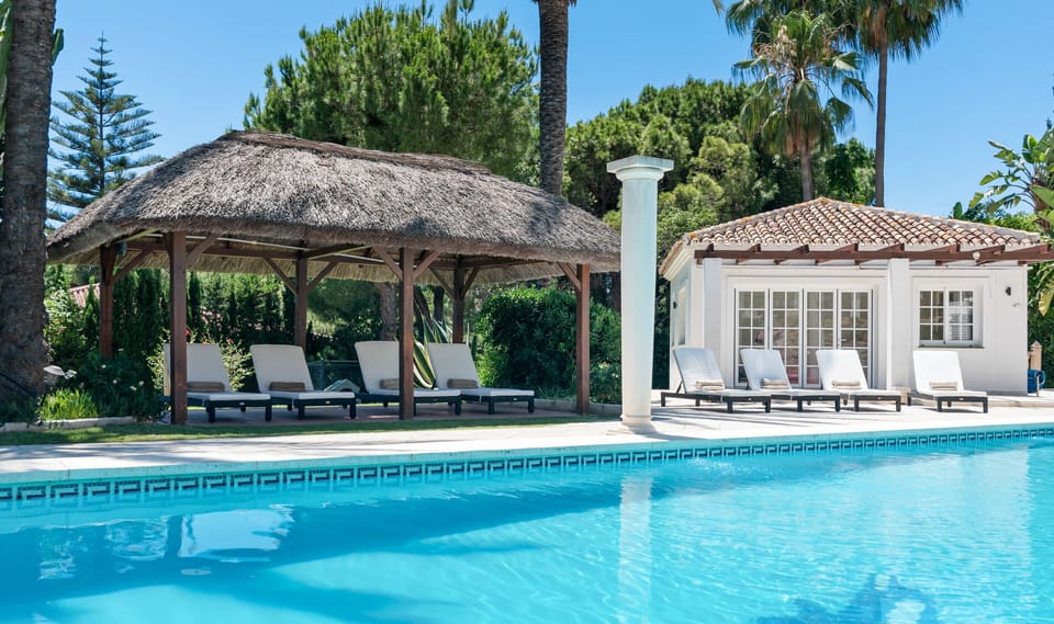Sun loungers at private pool.