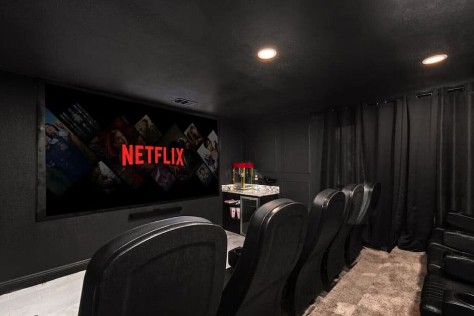 Theater Room: Immerse yourself in cinema magic with plush seating and your favorite streaming shows!