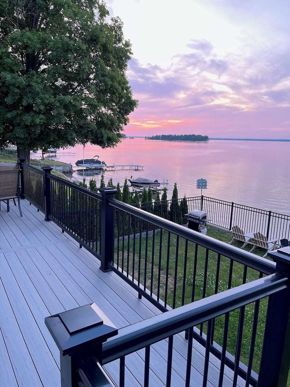 Step outside to your private backyard oasis with breathtaking lake views!