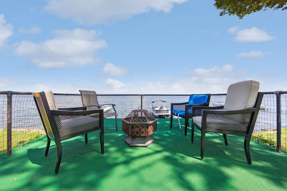 Unwind by the firepit with stunning Oneida Lake views—perfect for stargazing!