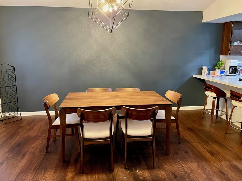 Dining for seating for six and 2 cushy bar stools. 