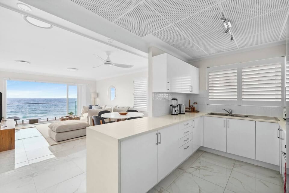 Cook up a feast in the fully equipped kitchen, complete with an oven, coffee maker, and spacious island bench—perfect for prepping beachside snacks or enjoying a lazy morning with a fresh brew.
