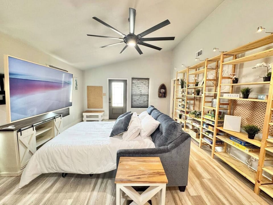 Sleeper sofe extended with TV arm fully extended to foot of the sofa