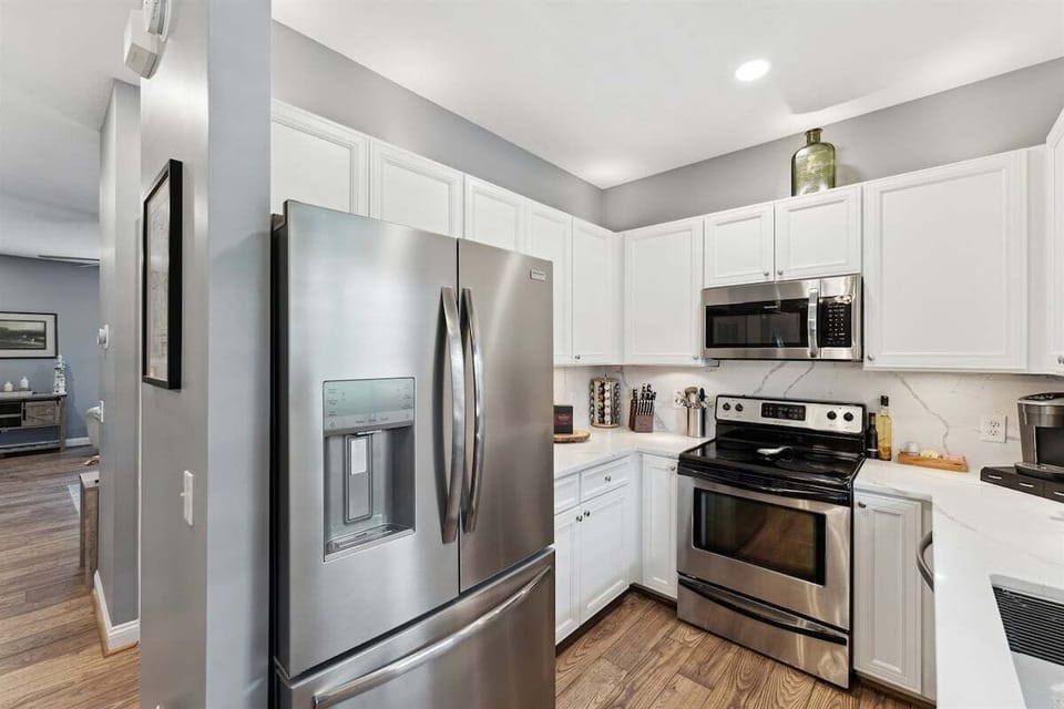 Fully equipped with stainless steel appliances for easy meal prep.