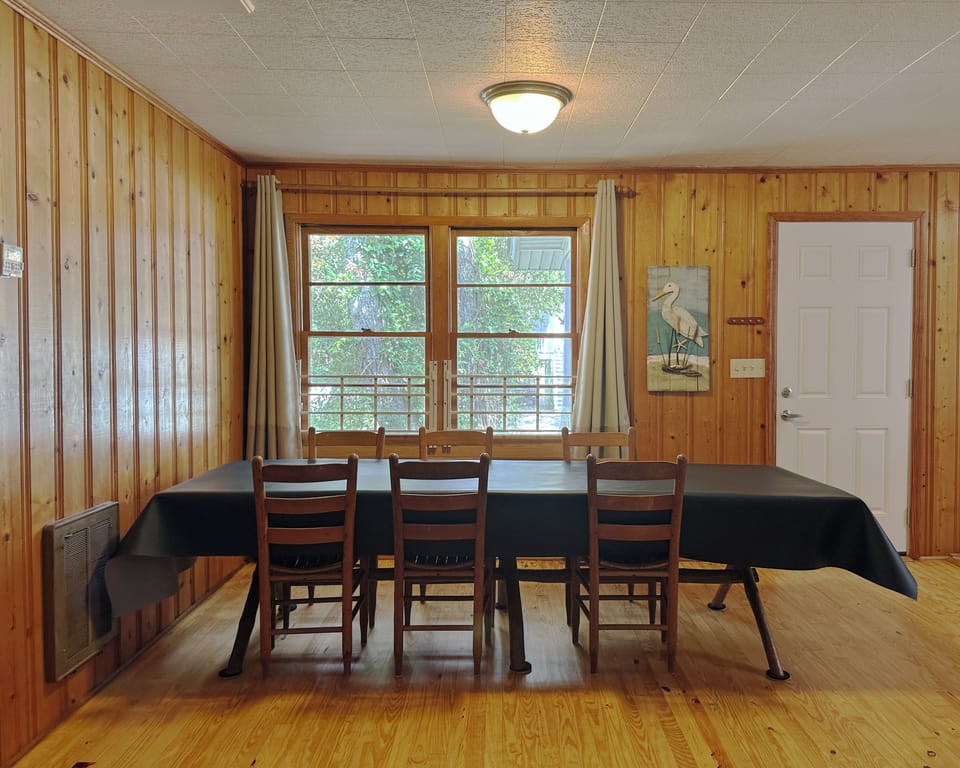 Large dining table. Lots of natural lighting!
