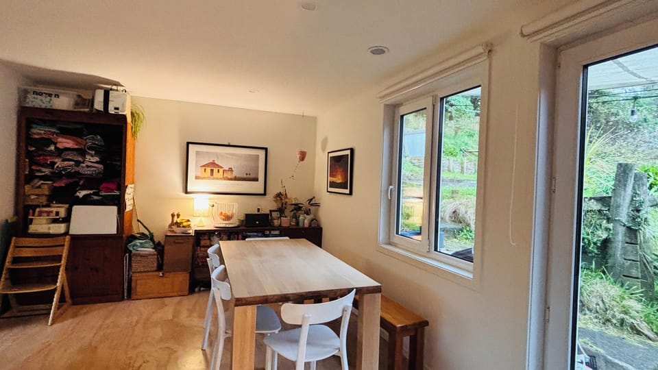 Level 2 - Kitchen and dining. A door steps onto small patio.