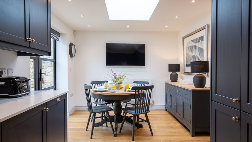 The bright and open kitchen is perfect for catching up on the activities of the day
