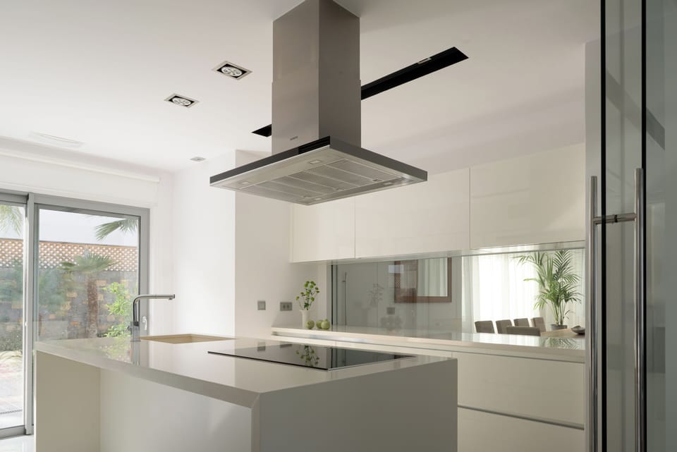 Bespoke furnishings and high-end appliances create a refined yet welcoming feel.