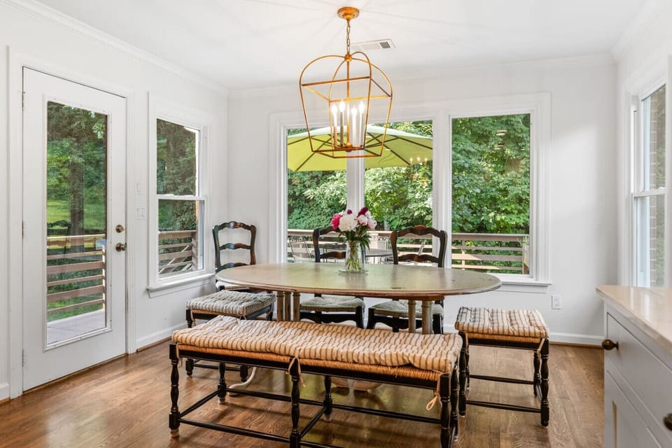 Lots of natural light in the dining room located off the kitchen with seating for 8.