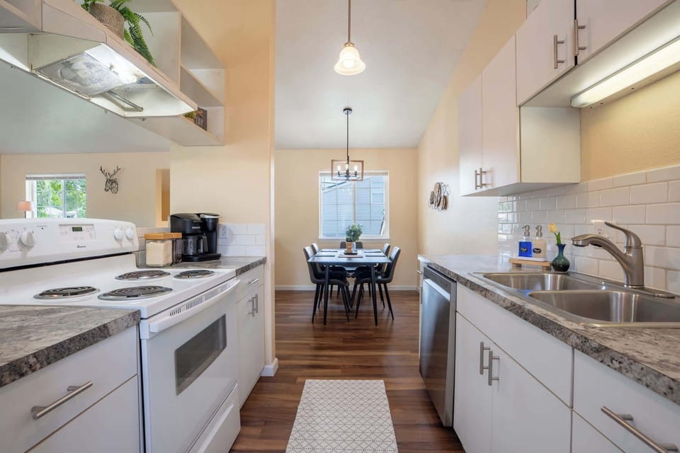 Functional meets stylish in this bright kitchen with subway tile, plenty of counter space, and thoughtful details throughout.
