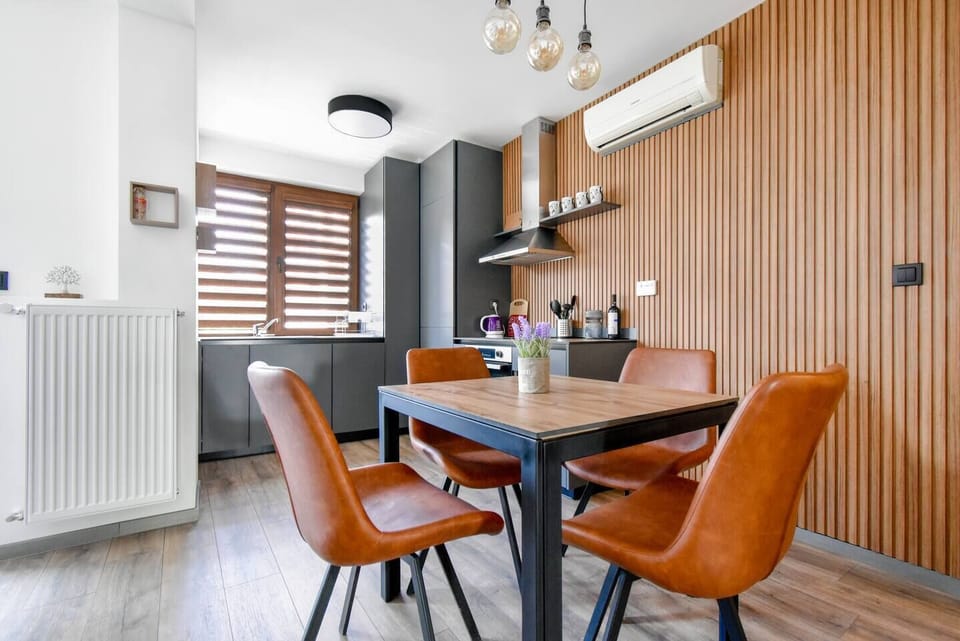 Dine in style beneath natural light and wood accents that warm up the entire space