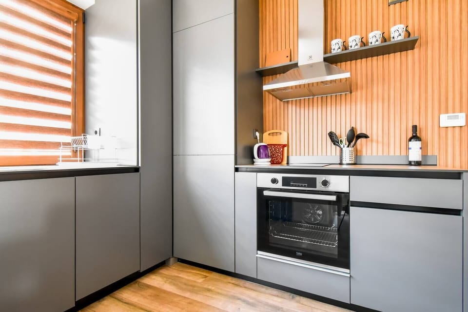 Cook, dine, and feel at home with everything you need in this sleek, fully equipped kitchen