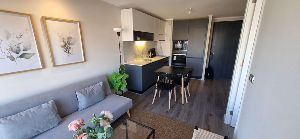Cozy studio with modern kitchenette and stylish decor, perfect for a relaxing stay in the heart of the city.