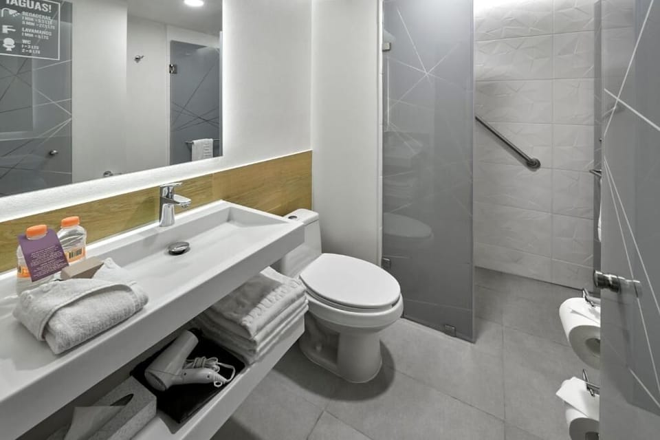 Refresh under a spacious shower after a full day out.