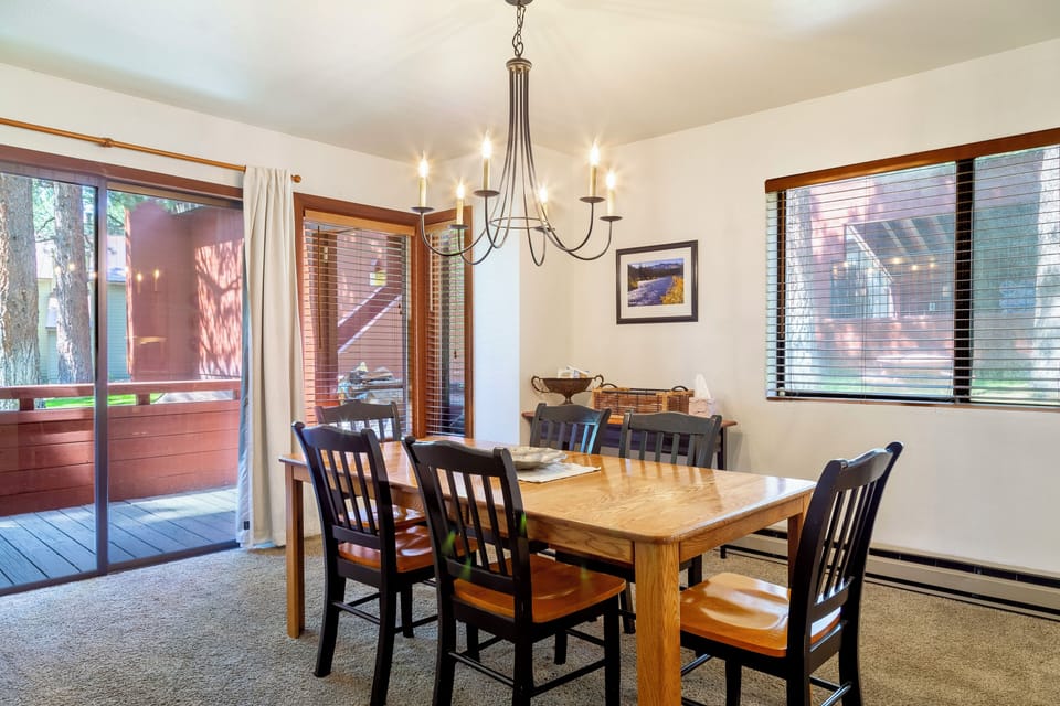 Dining room w/ seating for 6 overlooking private deck.