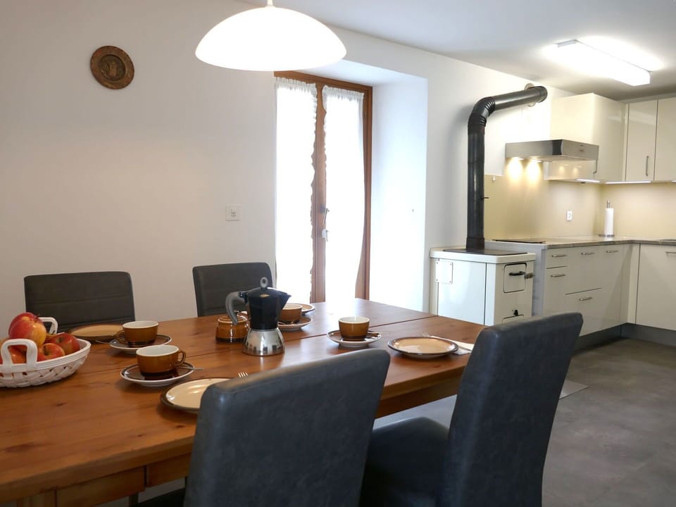 Furniture, Interior Design, Flooring, Chair, Wall, Table, Floor, Light Fixture, Wood, Kitchen & Dining Room Table