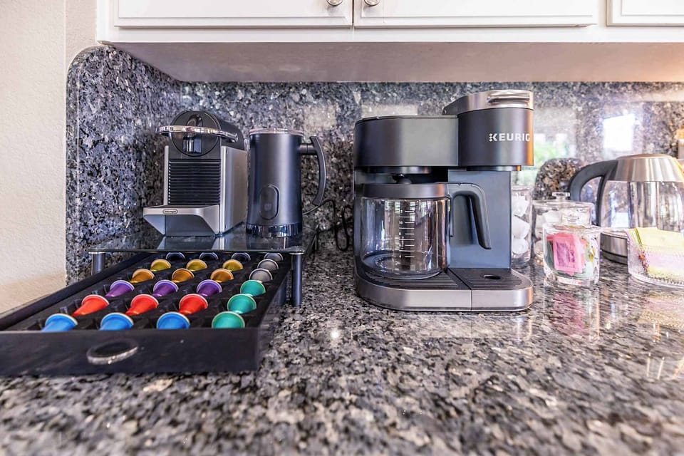Mornings made easy. Whether you’re team espresso, drip, or tea, our coffee bar has you covered with a Keurig, Nespresso, milk frother, and plenty of pods. Just pick your brew and start the day your way.
