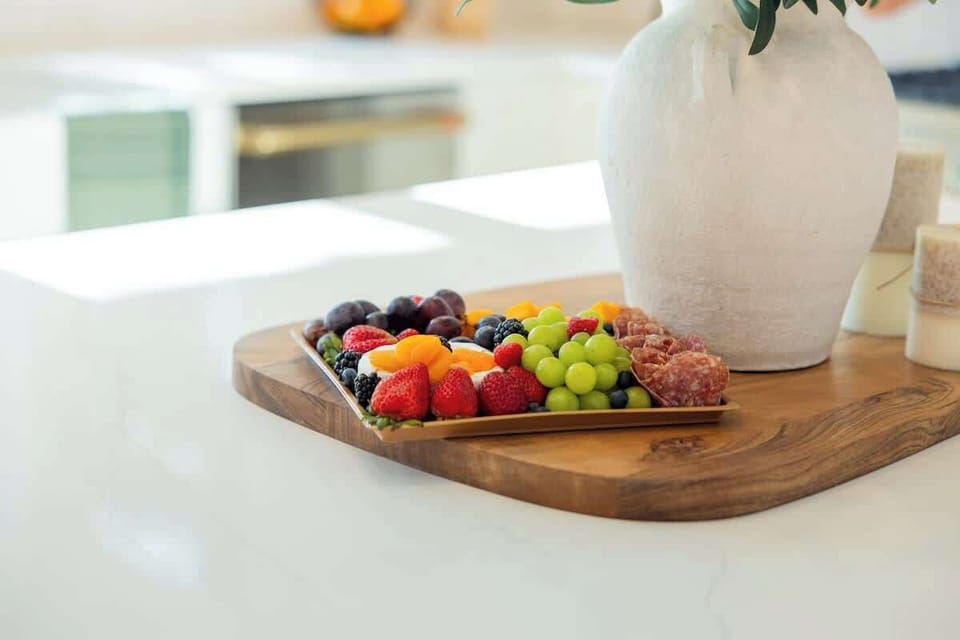 Picture-perfect for entertaining  Whether you're prepping a fruit board, charcuterie spread, or morning breakfast, this spacious island is the ideal spot to serve it all in style.
