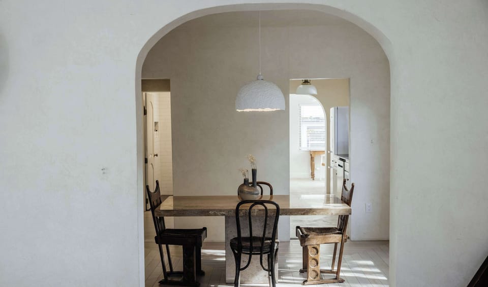 Dining room with seating for 4 on the marble dining room table with easy access to the kitchen and living room
