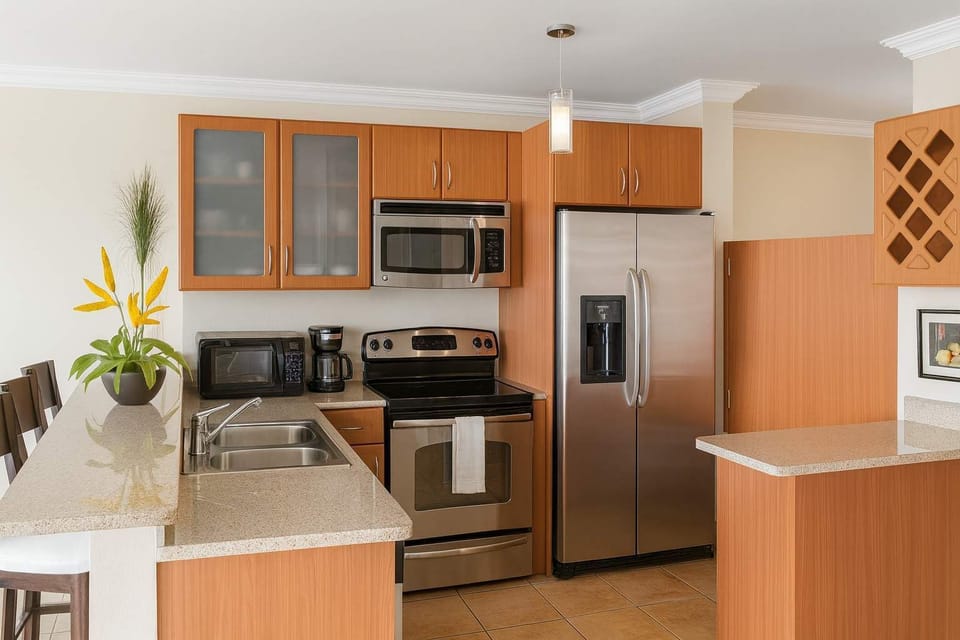 Modern kitchen equipped with stainless steel appliances, granite countertops, and all essentials — perfect for cooking and enjoying home-style meals during your stay.
