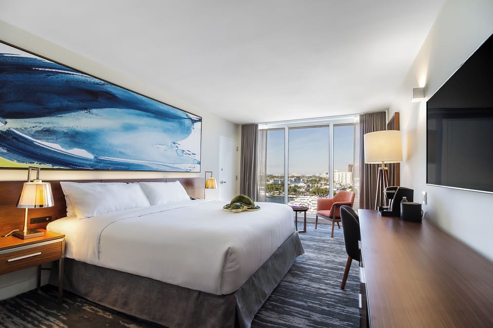 Wake up to skyline views from a plush king retreat.