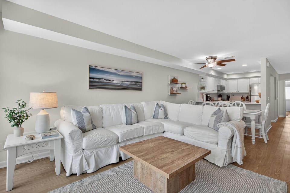 Comfortable living area with new coastal decor.