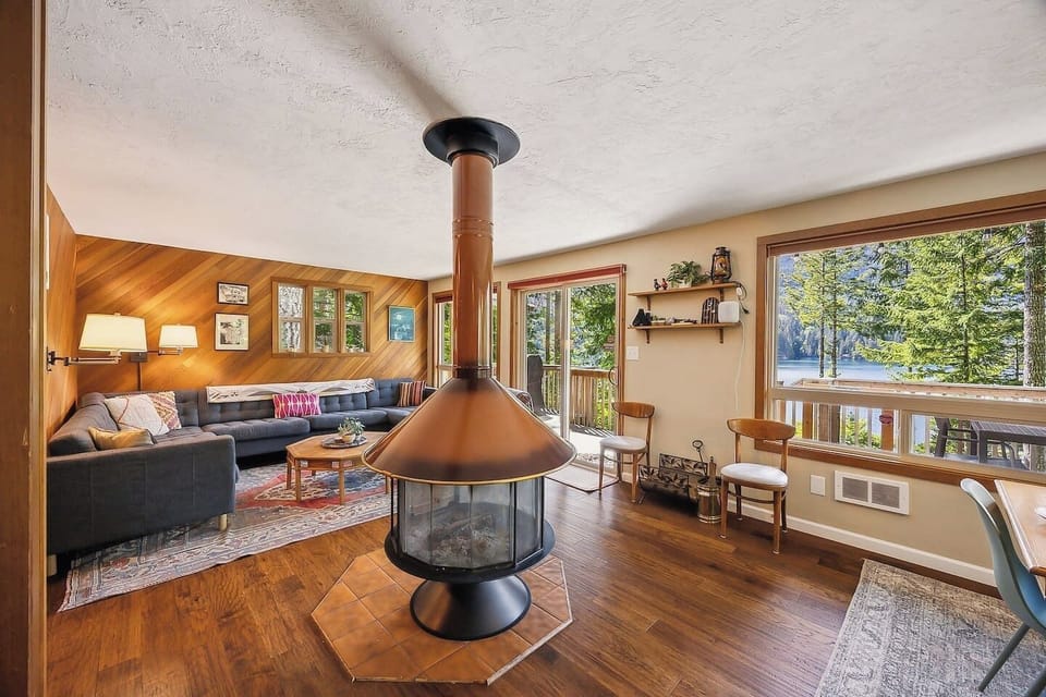 Vintage-retro circular fireplace anchors the living and dining rooms, heating the whole space!