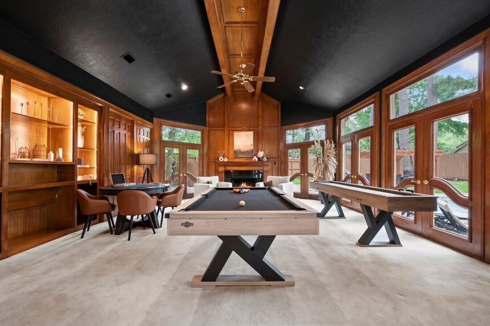 Game Room: Enjoy fun times with friends in this stylish space, featuring a pool table and scenic views!