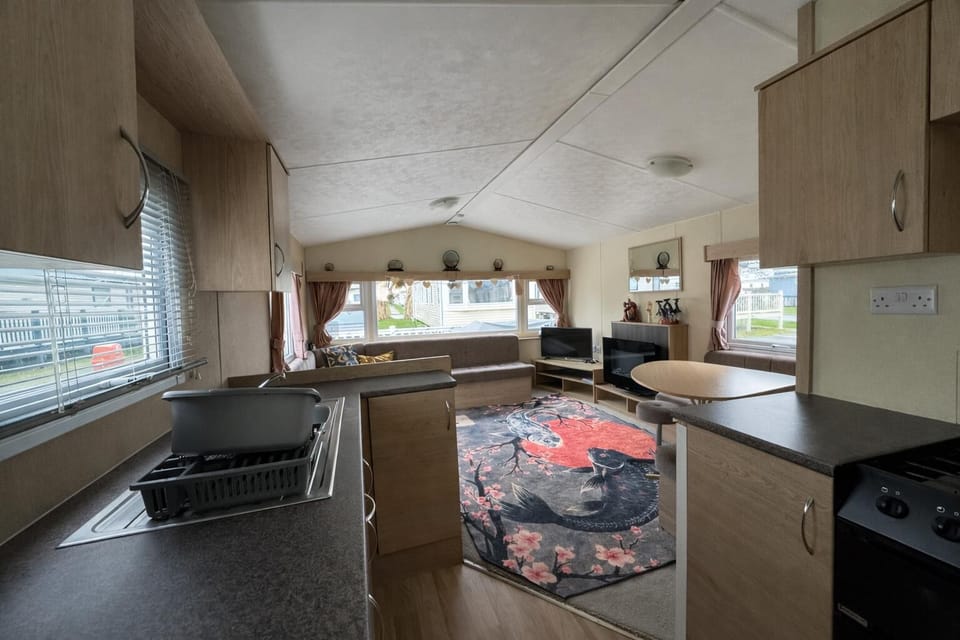 Make the most of your bank holidays with a caravan holiday in Essex, featuring a cosy kitchen area in a caravan for all your self-catering needs.